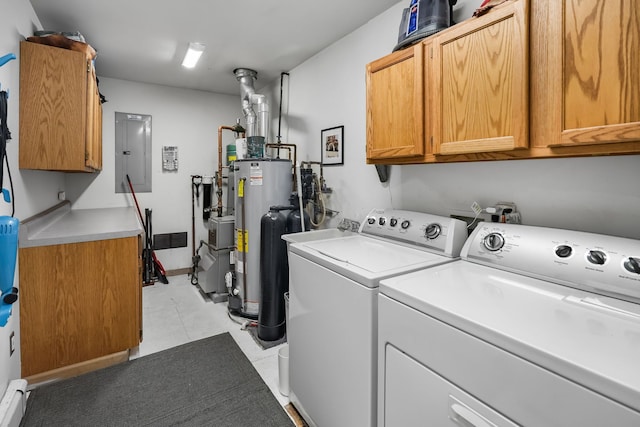 clothes washing area featuring separate washer and dryer, gas water heater, cabinet space, and electric panel