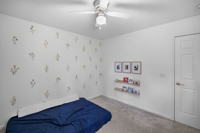 bedroom with carpet, ceiling fan, and baseboards