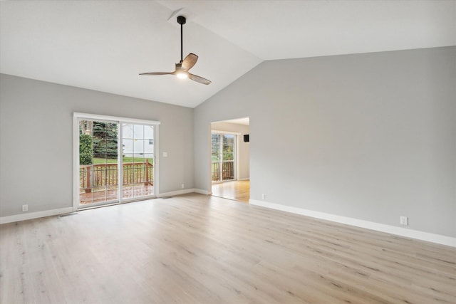 unfurnished room featuring visible vents, light wood-style flooring, a ceiling fan, vaulted ceiling, and baseboards