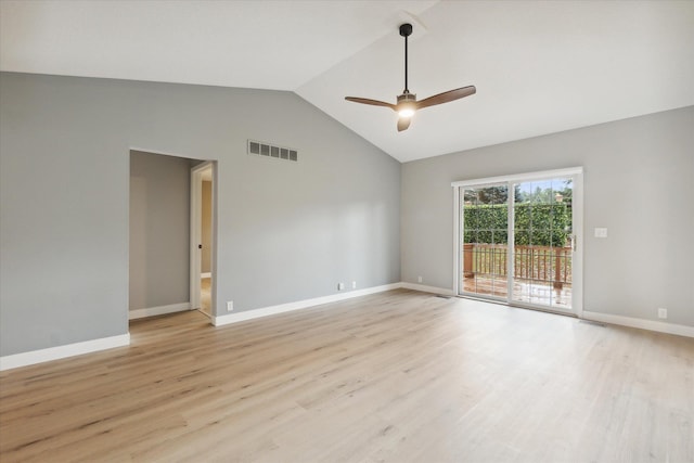 spare room featuring lofted ceiling, baseboards, visible vents, and light wood finished floors