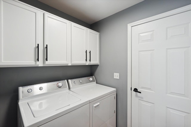 laundry room featuring cabinet space and washer and dryer