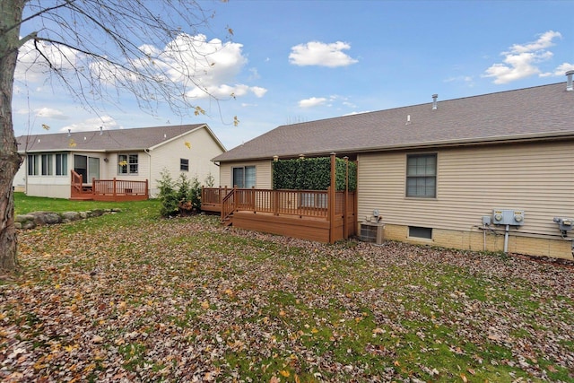 back of house featuring a deck and central air condition unit