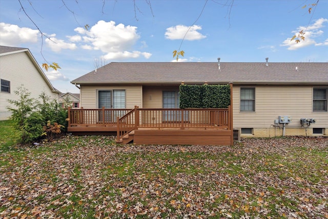 back of property featuring a deck