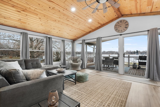 sunroom with vaulted ceiling, ceiling fan, and wooden ceiling