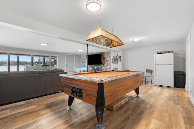 rec room with pool table and light wood finished floors