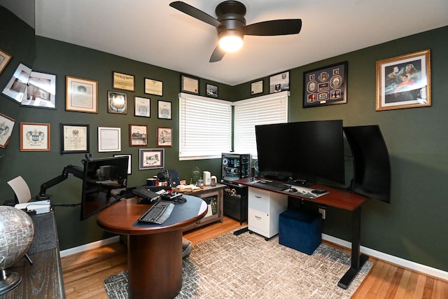 office featuring ceiling fan, baseboards, and wood finished floors