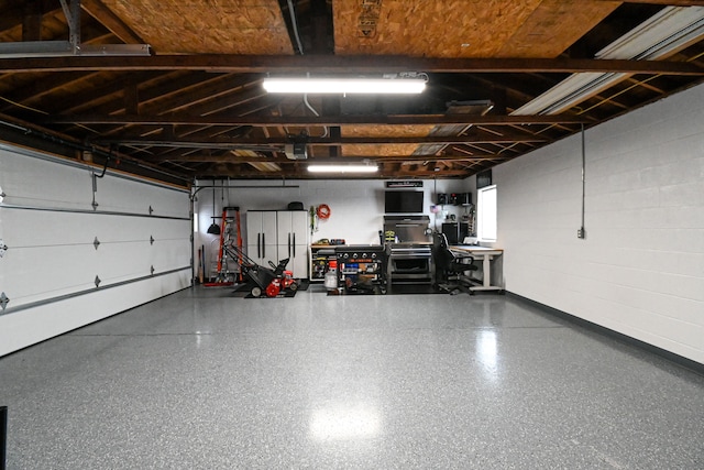 garage with concrete block wall