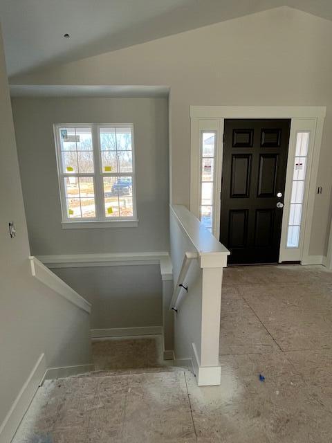 entrance foyer featuring vaulted ceiling