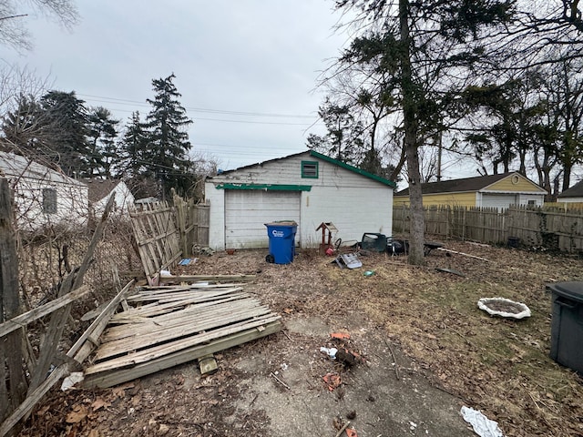 view of yard featuring fence and an outdoor structure