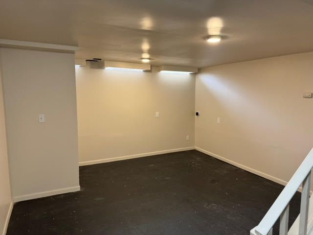 finished basement featuring baseboards