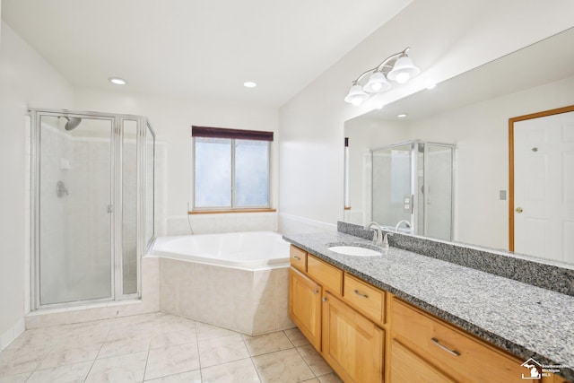 bathroom featuring tile patterned floors, a shower stall, vanity, and a bath