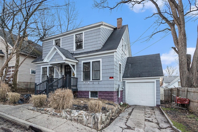 view of front facade featuring a chimney, fence, aphalt driveway, and roof with shingles