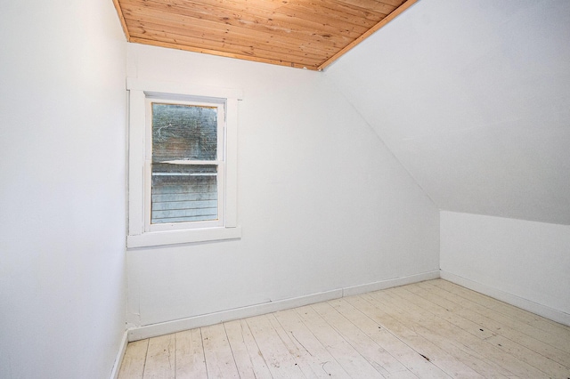 bonus room featuring lofted ceiling, wood ceiling, and light wood-style flooring