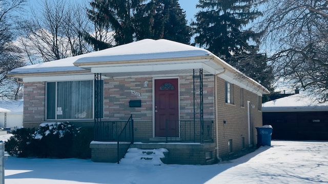 view of front of home with brick siding