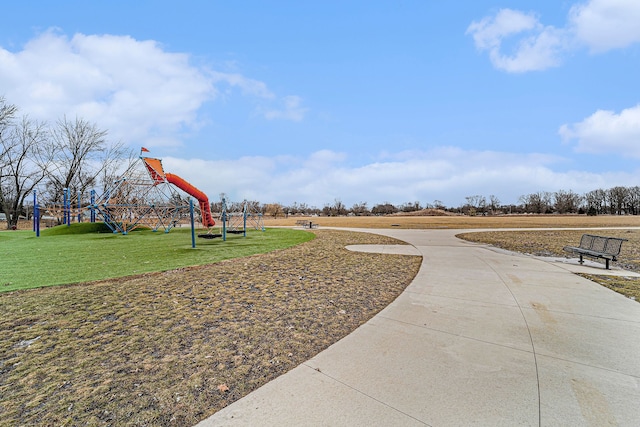 surrounding community with playground community and a lawn