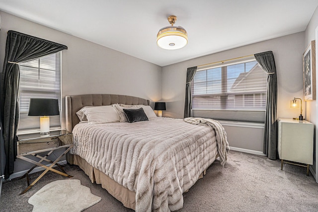 bedroom featuring carpet and baseboards