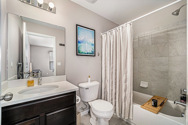 full bathroom featuring toilet, shower / tub combo, vanity, baseboards, and tile patterned floors