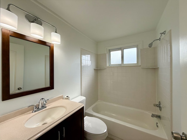 bathroom featuring washtub / shower combination, vanity, and toilet