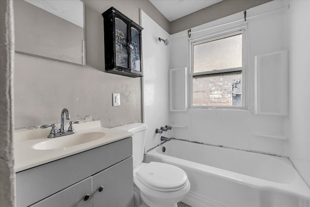 bathroom with bathing tub / shower combination, vanity, and toilet