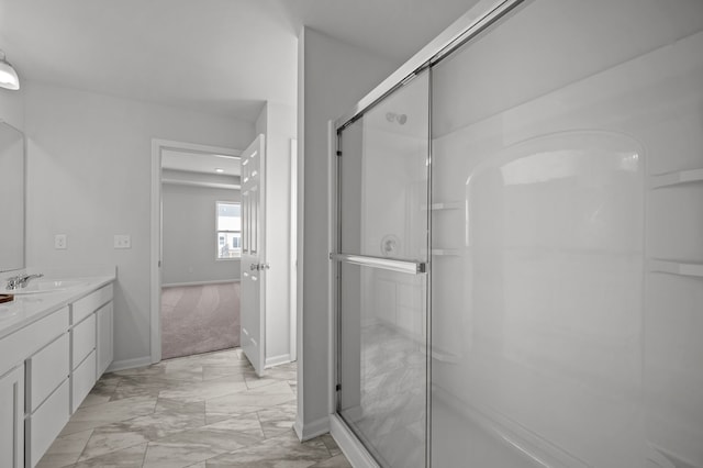 bathroom featuring baseboards, vanity, marble finish floor, and a shower stall