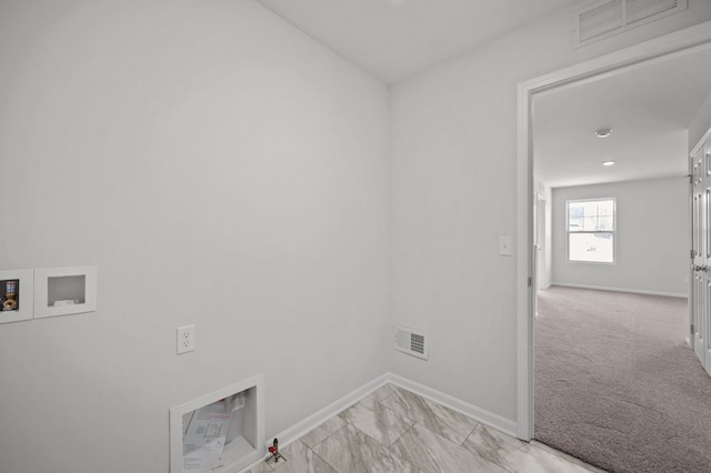 clothes washing area with visible vents, baseboards, washer hookup, and laundry area