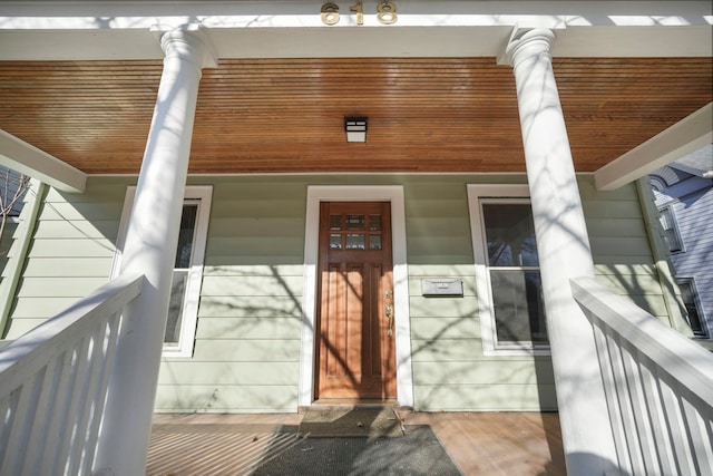 doorway to property featuring covered porch