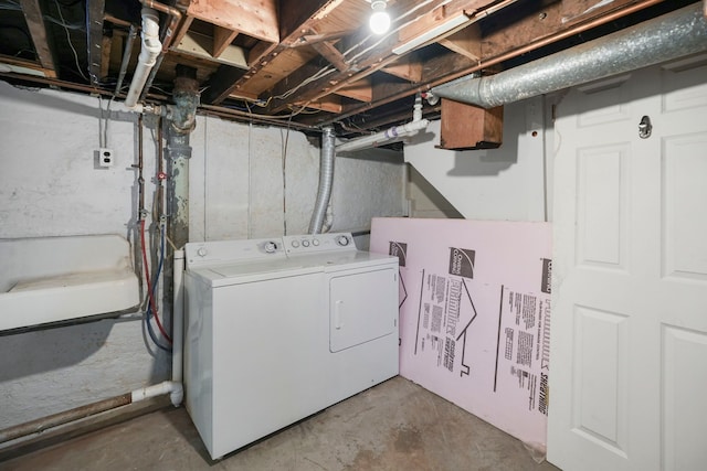 washroom featuring laundry area and washing machine and dryer