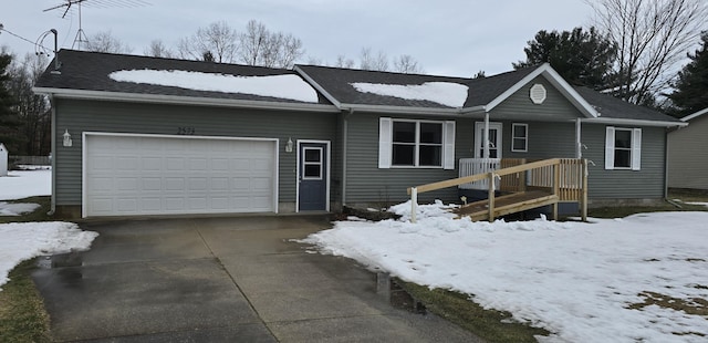 ranch-style home featuring driveway and an attached garage