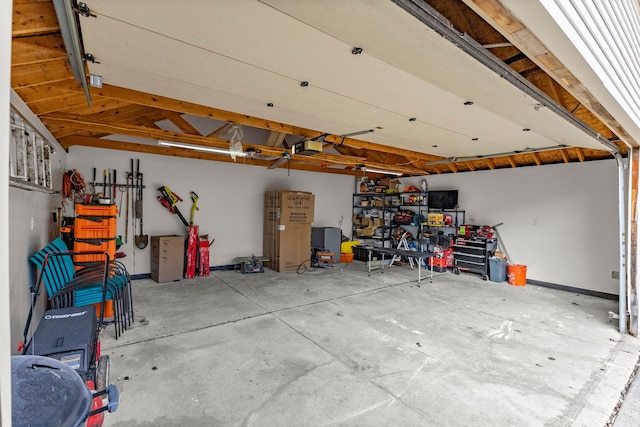 garage featuring baseboards and a garage door opener