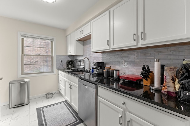 kitchen with decorative backsplash, marble finish floor, white cabinetry, and stainless steel dishwasher