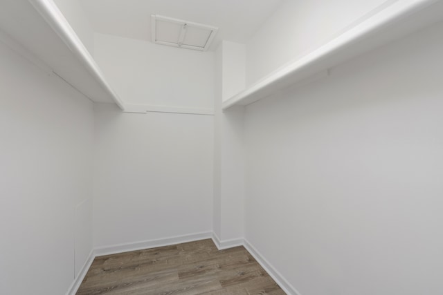 spacious closet with wood finished floors