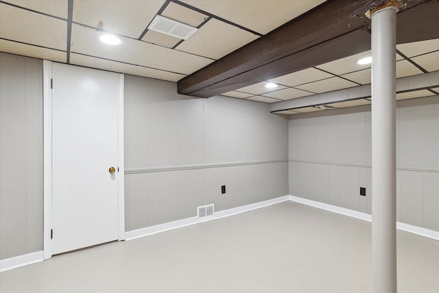 finished basement with recessed lighting, baseboards, visible vents, and a drop ceiling