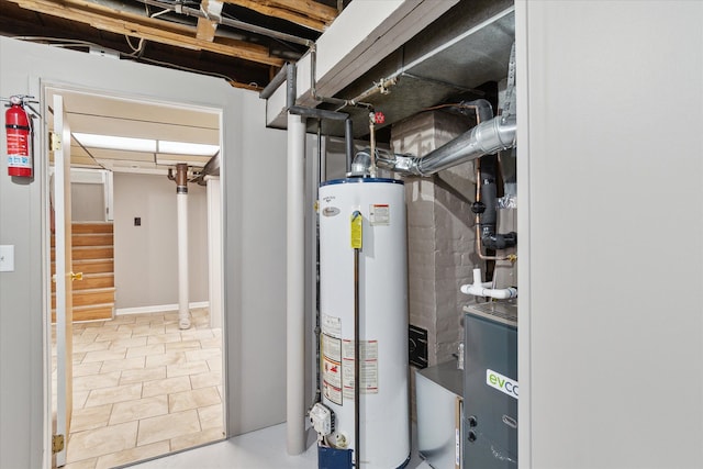 utility room with gas water heater