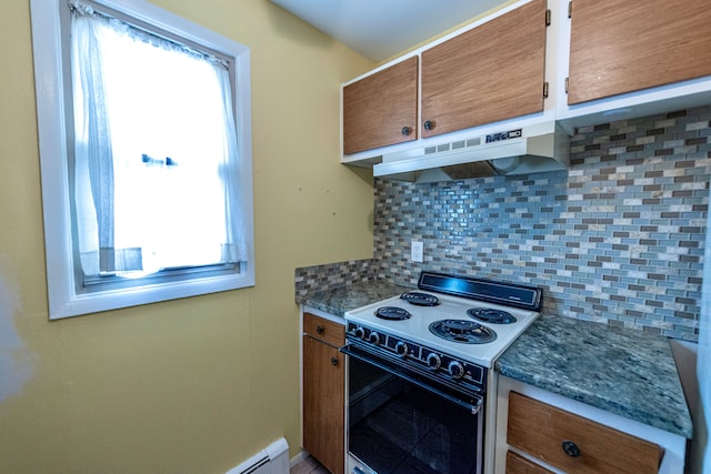 kitchen featuring plenty of natural light, brown cabinets, range with electric stovetop, and under cabinet range hood