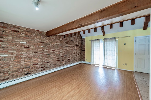 spare room with baseboards, brick wall, wood finished floors, baseboard heating, and beam ceiling