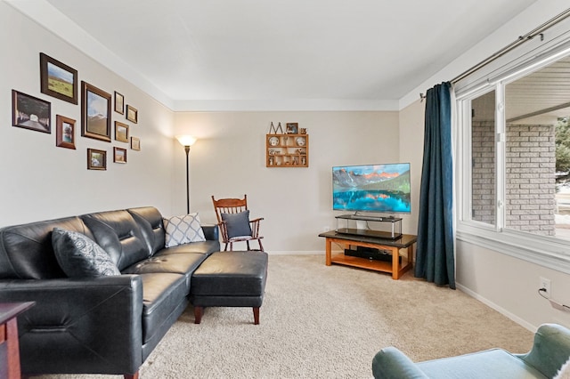 living room featuring carpet flooring and baseboards