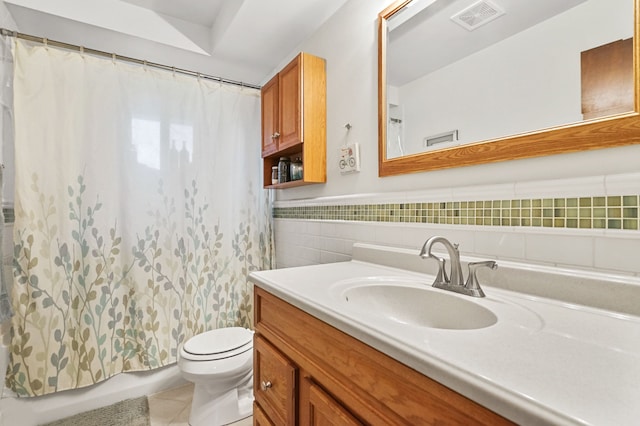 full bath with a wainscoted wall, tile walls, visible vents, toilet, and vanity