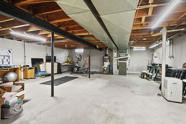 unfinished basement featuring heating unit and gas water heater