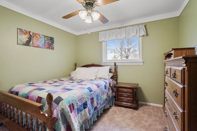 bedroom featuring baseboards, a ceiling fan, and light colored carpet