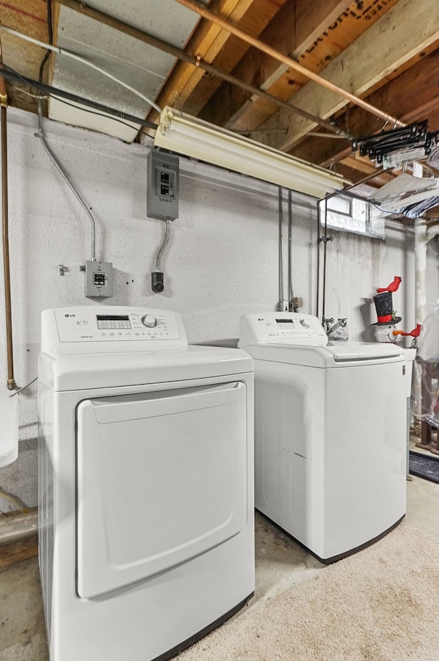 washroom featuring washer and dryer and laundry area