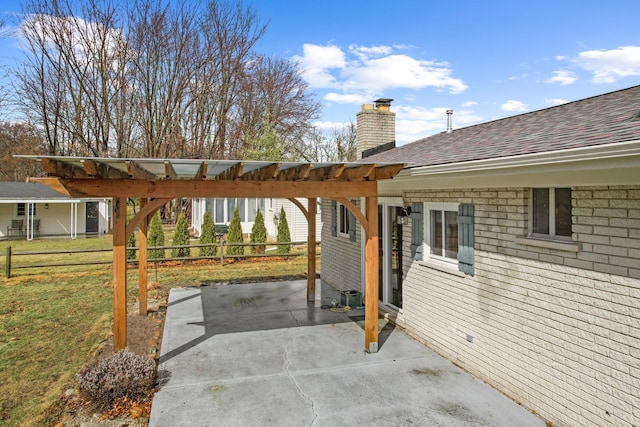 view of patio / terrace featuring fence