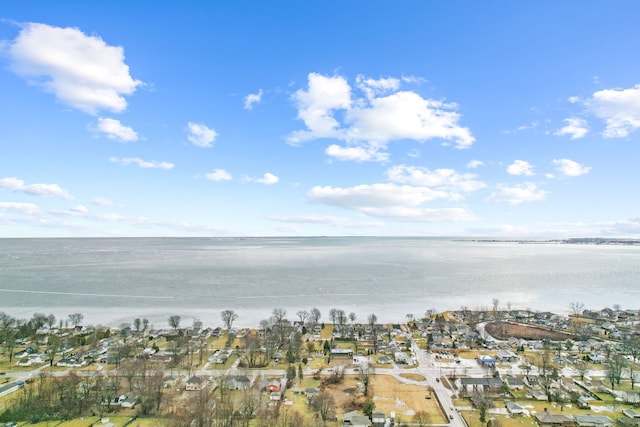 birds eye view of property featuring a water view and a residential view