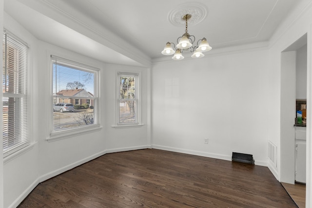 unfurnished dining area with visible vents, crown molding, baseboards, a chandelier, and dark wood-style flooring