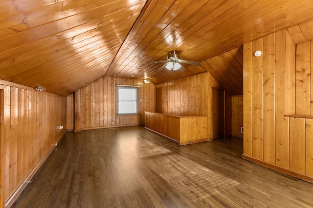 additional living space featuring wood walls, wood ceiling, lofted ceiling, and wood finished floors