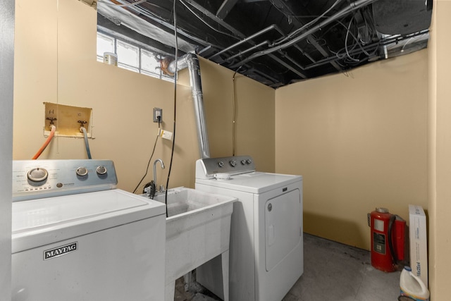 laundry area with laundry area and independent washer and dryer