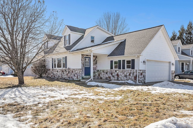 view of front of property featuring stone siding, roof with shingles, and an attached garage