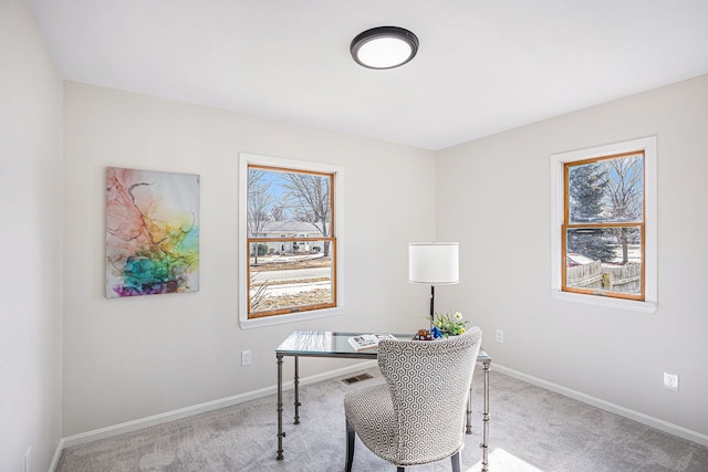 carpeted home office featuring visible vents, a healthy amount of sunlight, and baseboards