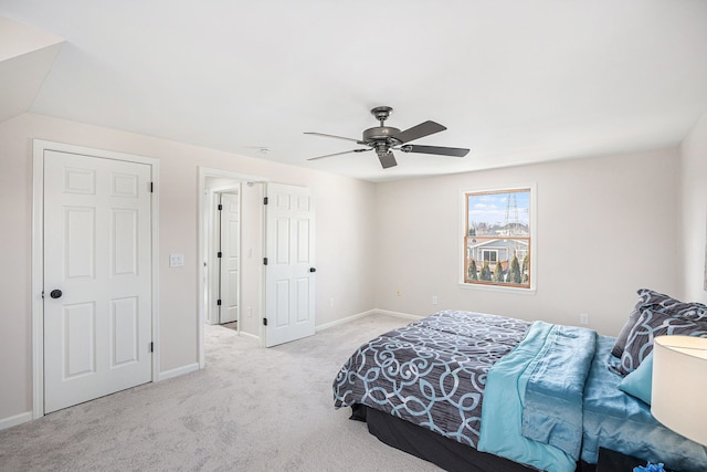 bedroom featuring baseboards, ceiling fan, and carpet flooring