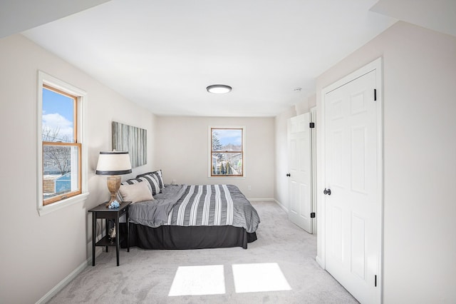 carpeted bedroom with baseboards