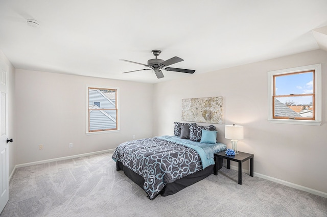 bedroom with baseboards, carpet, and a ceiling fan